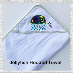 Image of green trim hooded bath towel with embroidered Jellyfish